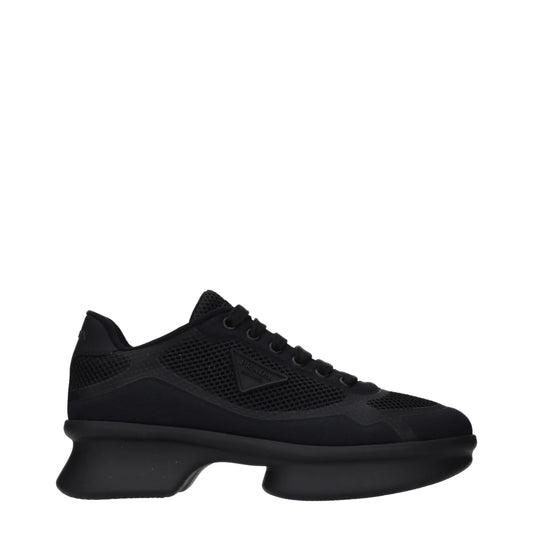 Black designer sneaker with mesh panels and chunky sole, side logo detail visible