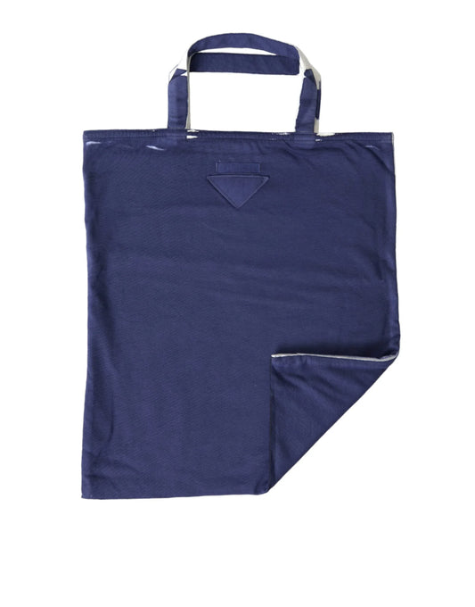 Navy blue fabric tote bag with double handles and a folded corner, on white background