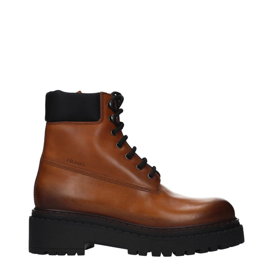 Brown leather lace-up combat boot with chunky black sole and padded collar